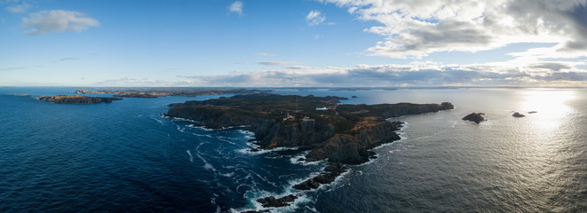 Aerial view of a rocky Atlantic Ocean Coast during a cloudy sunset. Taken in Twillingate, Newfoundland, Canada.