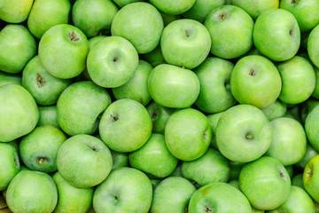 Background of green apples on sale at the local market. Green apple Raw fruit and vegetable backgrounds overhead perspective