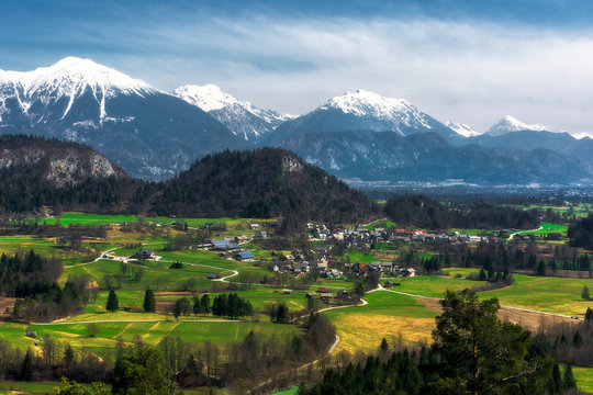 Village And Mountain Range Karawanks In Slovenia