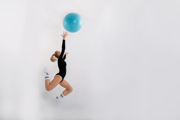 young athletic girl engaged in fitness with the ball