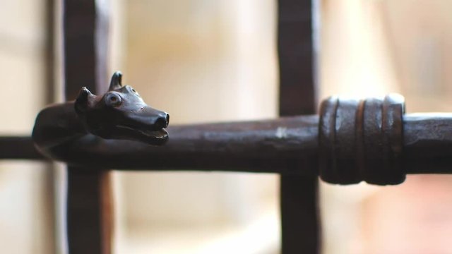 Closeup of the Locking Bolt of the street gate of Campo Santo Cloister, by the Perpignan Cathedral. An Iron Dragon is visible, as is the Padlock and chain that locks the gate secure.