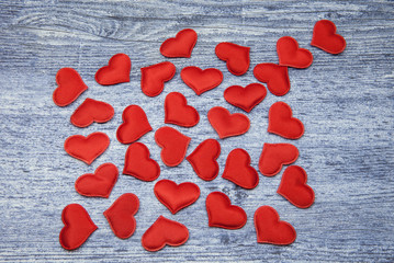 Many red hearts on denim wooden Background. Valentines and 8 March Mother Women's Day concept