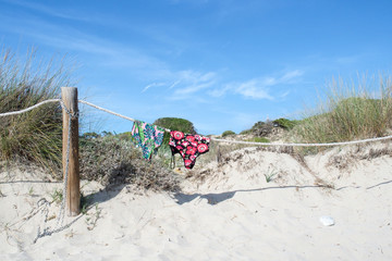 Two swimsuits on the rope