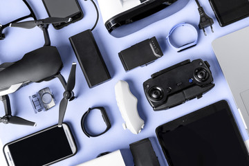 background of modern gadgets on a blue surface