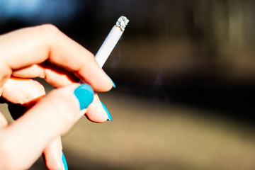 Young woman enjoying a cigarette