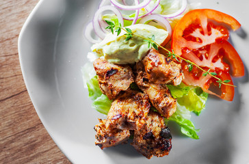 fried chicken breast piece fillet with vegetables salad on white plate