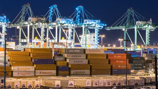 Timelapse of Cranes Loading Containers in Port of Los Angeles -Pan Left-