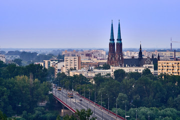 Warsaw, Poland - August 11, 2017: Beautiful panoramic view from old town of Cathedral Parish of St. Michael the Archangel and St. Florian in Warsaw. - obrazy, fototapety, plakaty