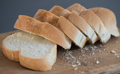 fresh cut bread is shown on a cutting board