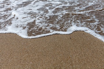 Closeup of Wave of the Sea on a Beach
