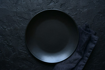 Culinary background with empty plate and napkin.Top view with copy space.