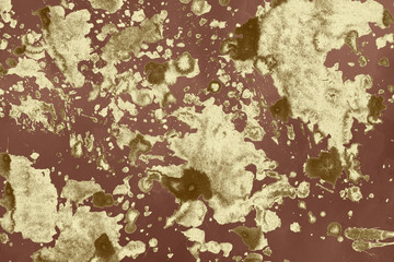 Luxury gold and white metal paint splatter effect on watercolor paper background. Gold glitter splash texture. Beautiful feminine backdrop.