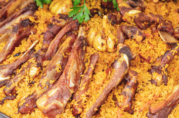 Pilaf closeup with meat ribs.