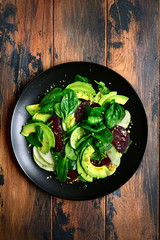 Vegetable salad with avocado, apple, beetroot, spinach and walnut.Top view with copy space.