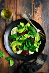 Vegetable salad with avocado, apple, beetroot, spinach and walnut.Top view with copy space.