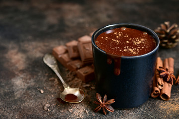 Homemade spicy hot chocolate in a black cup.
