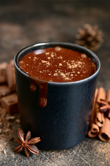 Homemade spicy hot chocolate in a black cup.