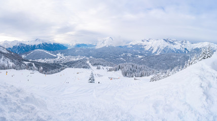 Fototapeta na wymiar Wide panoramic view of winter landscape with snow covered Alps in Seefeld in the Austrian state of Tyrol. Winter in Austria