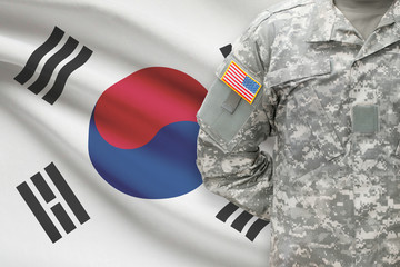 American soldier with flag on background - South Korea