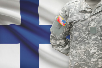 American soldier with flag on background - Finland