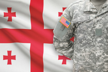 American soldier with flag on background - Georgia