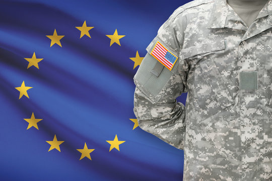 American soldier with flag on background - European Union - EU