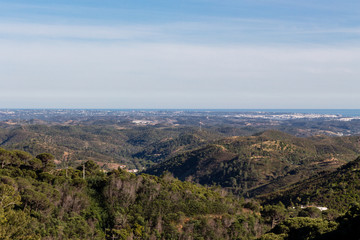 Fototapeta na wymiar Beautiful nature landscape (panorama) in Alentejo, Portugal. Beautiful hills and ocean in the far background.