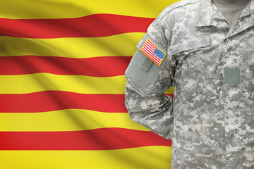 American soldier with flag on background - Catalonia - Spain
