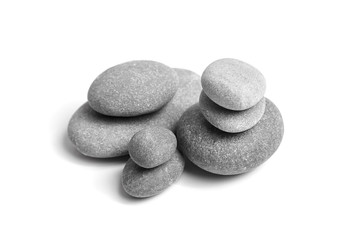 Fototapeta na wymiar Group of smooth grey stones. Sea pebble. Stacked pebbles isolated on white background