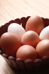 Eggs In Wooden Basket On Wooden Table Close-up