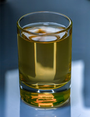 Pure water is poured into a glass beaker.