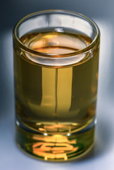 Pure water is poured into a glass beaker.