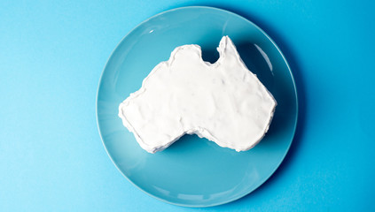 vanilla cream cake in a shape of the Australia - Happy Australia Day message greeting card  