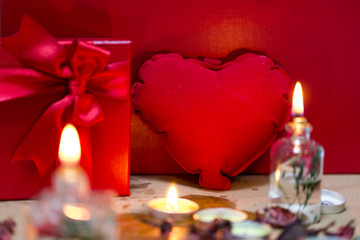 Beautiful candles and gifts burning on Valentine's Day
