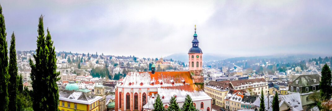 Panoramic view of Stiftskirche church with Baden-baden small cute town in winter fairytale in the Black Forest southwest of Germany. Famous German city with spa for vacations, holidays.