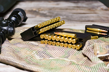Tactical eqipment on the multicam background. Carbine, ammo in 308 win calibre.