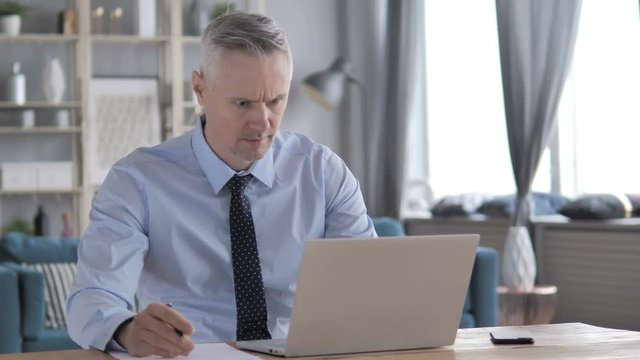 Gray Hair Businessman Writing on Paper at Work, Paperwork