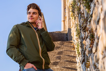 Fototapeta premium Young man at cellphone