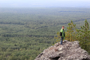 Fototapeta premium tourist on top of the mountain