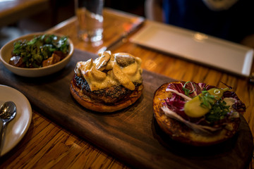 deconstructed cheeseburger on a platter
