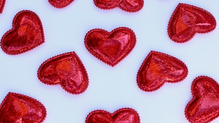 group of red shiny hearts on a white background for valentines day
