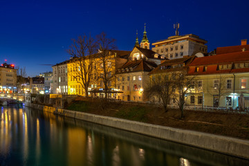 View of Ljubljanica river and tromostovje in old city center in the evening, Ljubljana, Slovenia