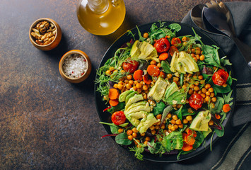 Avocado, roasted tomato, greens and chickpeas salad