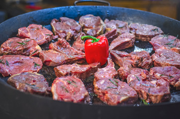 juicy flavored grilled steaks on fire