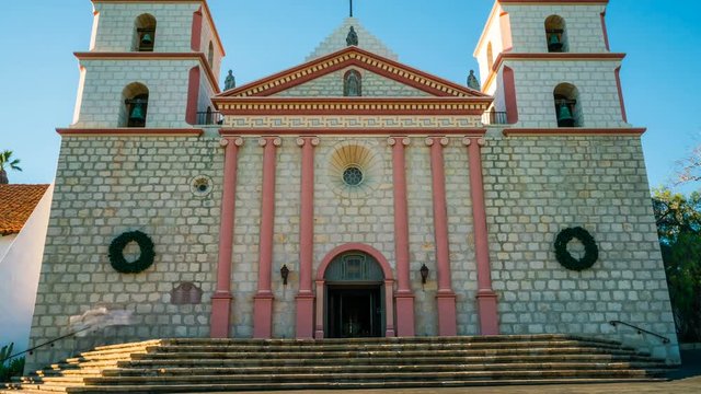 Timelapse of Tourists at Historic Church in Santa Barbra -Tilt Up-