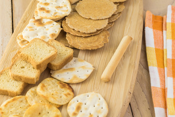 Assorted crackers, potato chips, mini party toasts.