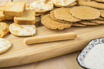 Assorted crackers, potato chips, mini party toasts.
