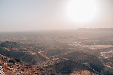 Hikers walking on a mountain top in the desert of India