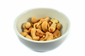 cashew nuts isolated on white bowl / cashew nuts roasted crispy cook roasted bean baked salt