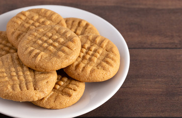 Classic Homemade Peanut Butter Cookies on a White Saucer